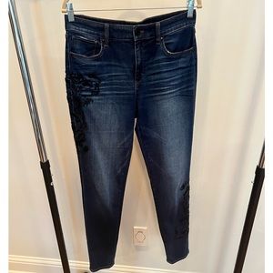 WHBM denim jean with embroidered and beaded details on hip and calf